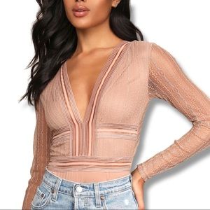 Nude long sleeve body suit from LuLu’s Casita Beige Sheer Lace Bodysuit
